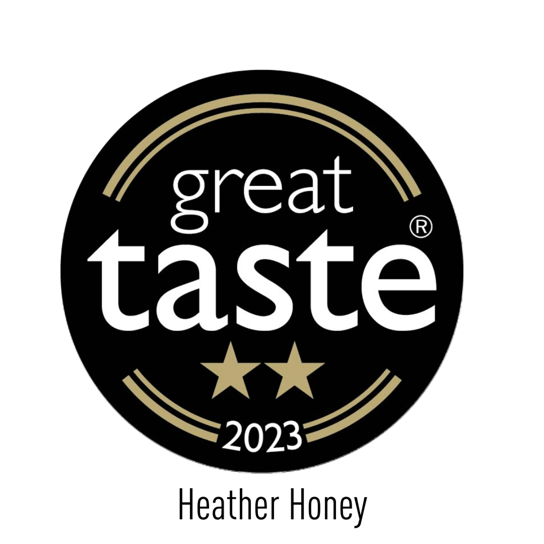 A black circular badge with gold accents reading "great taste" in white text, two gold stars below, and "2023" at the bottom, indicating a 2023 Great Taste Award.