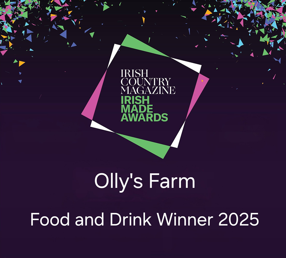 A colorful confetti background with the Irish Country Magazine Irish Made Awards logo. Text below reads: “Olly's Farm Food and Drink Winner 2025.”.