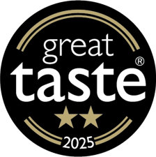 A black circular badge with gold accents. The words "great taste" are centered, with two gold stars below and "2025" at the bottom. The badge signifies a two-star Great Taste award for 2025.