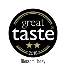 Black circular badge with "great taste" in white text, two gold stars beneath, and "2018" at the bottom, indicating a two-star award from the Great Taste Awards.