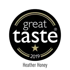 A circular black badge with gold accents, featuring the words "great taste" in white, a gold star below, and "2019" at the bottom.