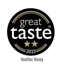 A black circular badge with gold accents reading "great taste" in white text, two gold stars below, and "2023" at the bottom, indicating a 2023 Great Taste Award.