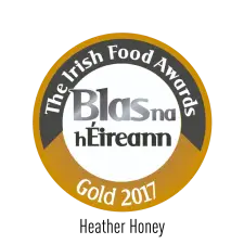 A circular gold and black badge with the text "The Irish Food Awards," "Blas na hÉireann," and "Gold 2017" indicating a gold award from the 2017 Irish Food Awards.