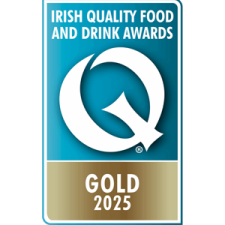 A blue and gold badge displaying a large white "Q" with the text "Irish Quality Food and Drink Awards" above and "Gold 2025" below.